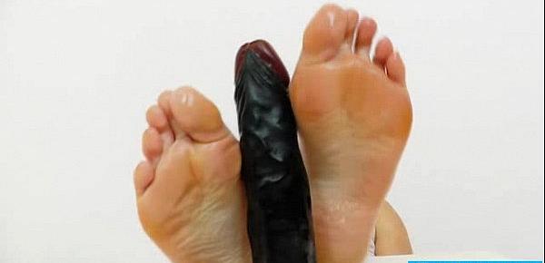  Dark fake penis gets a footjob